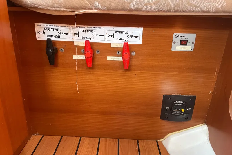 Slide: The Image of Electrical panel of a 2006 Beneteau Oceanis Clipper 373 sailboat, featuring battery switches. - 34