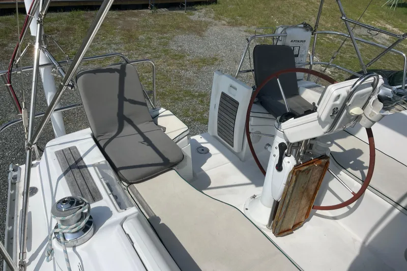 Slide: The Image of 2006 Beneteau Oceanis Clipper 373 cockpit with steering wheel and seating area. - 4