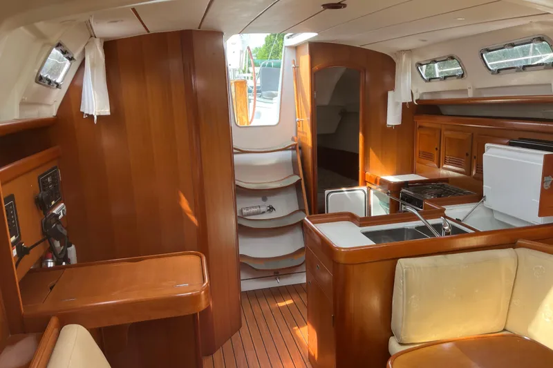 Slide: The Image of Interior of 2006 Beneteau Oceanis Clipper 373 yacht with wood finish and compact kitchen. - 25
