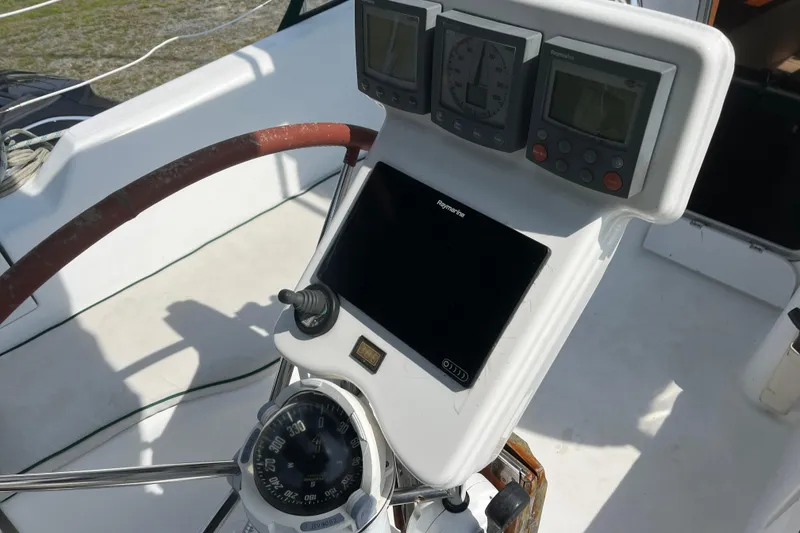 Slide: The Image of Steering console of 2006 Beneteau Oceanis Clipper 373 with navigation instruments. - 3