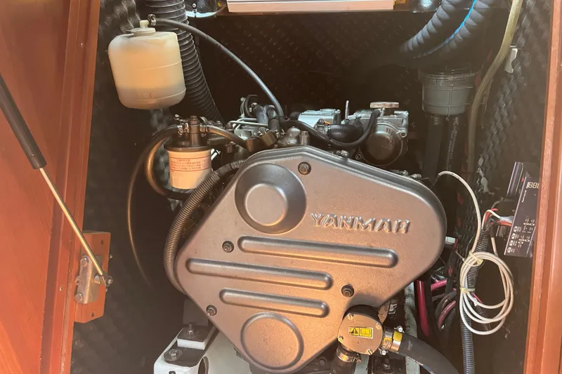 Slide: The Image of Engine compartment of a 2006 Beneteau Oceanis Clipper 373 sailboat, featuring a Yanmar engine. - 35