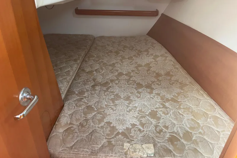 Slide: The Image of Cozy cabin bed in 2006 Beneteau Oceanis Clipper 373 sailboat interior. - 30