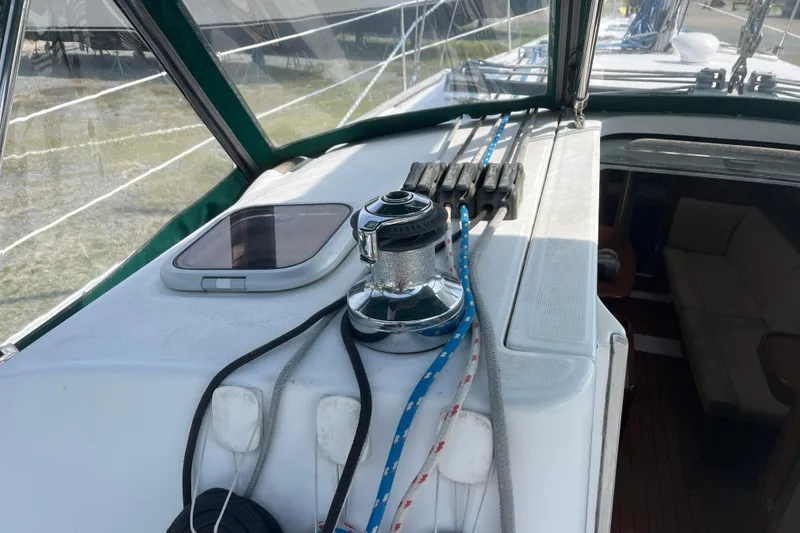 Slide: The Image of 2006 Beneteau Oceanis Clipper 373 yacht deck with winch and ropes. - 41