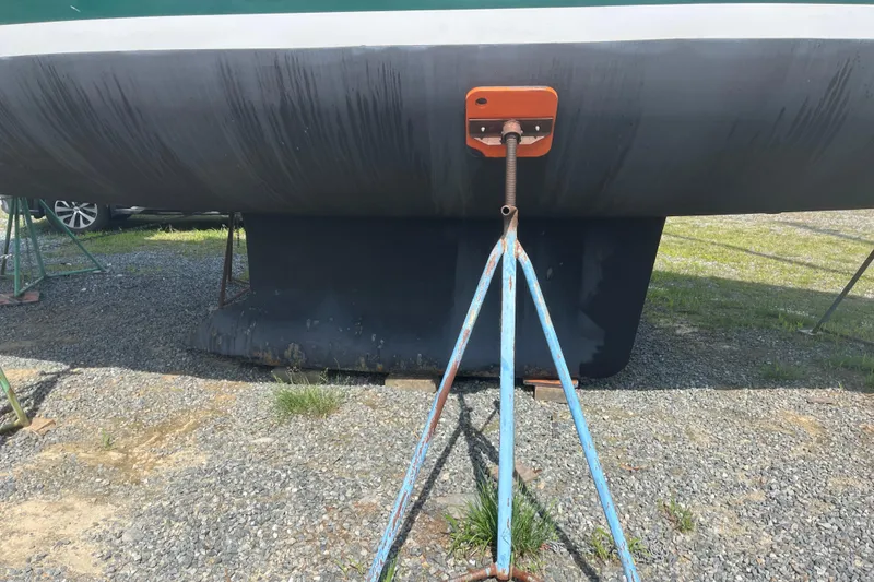 Slide: The Image of 2006 Beneteau Oceanis Clipper 373 sailboat hull on stands, gravel ground. - 43