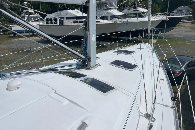 Slide: The Image of 2006 Beneteau Oceanis Clipper 373 sailboat on land, with visible deck and rigging. - 7