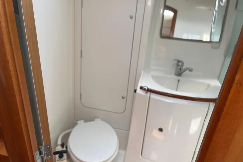 Slide: The Image of Bathroom interior of 2006 Beneteau Oceanis Clipper 373 yacht, featuring sink and toilet. - 19