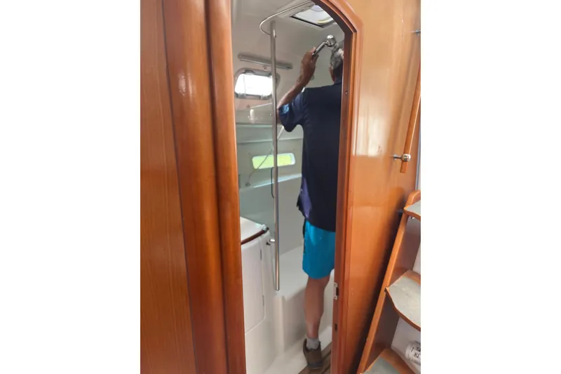 Slide: The Image of Interior of 2006 Beneteau Oceanis Clipper 373 yacht bathroom with wooden door and shower. - 20