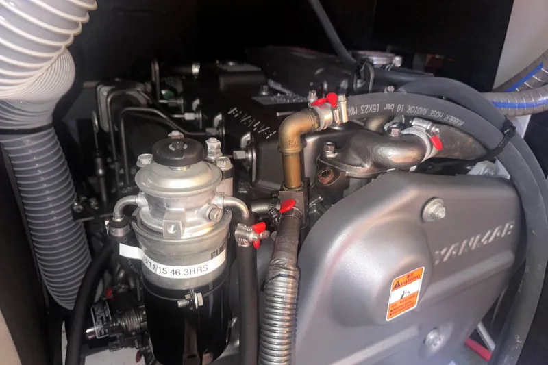Slide: The Image of Engine compartment of a 2014 Jeanneau Sun Odyssey 509 sailboat, featuring Yanmar components. - 37