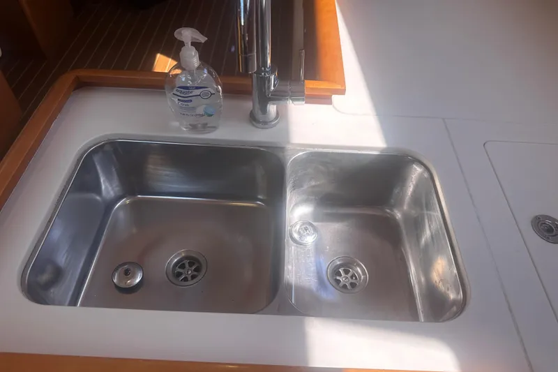 Slide: The Image of Double stainless steel sink in 2014 Jeanneau Sun Odyssey 509 yacht kitchen. - 30