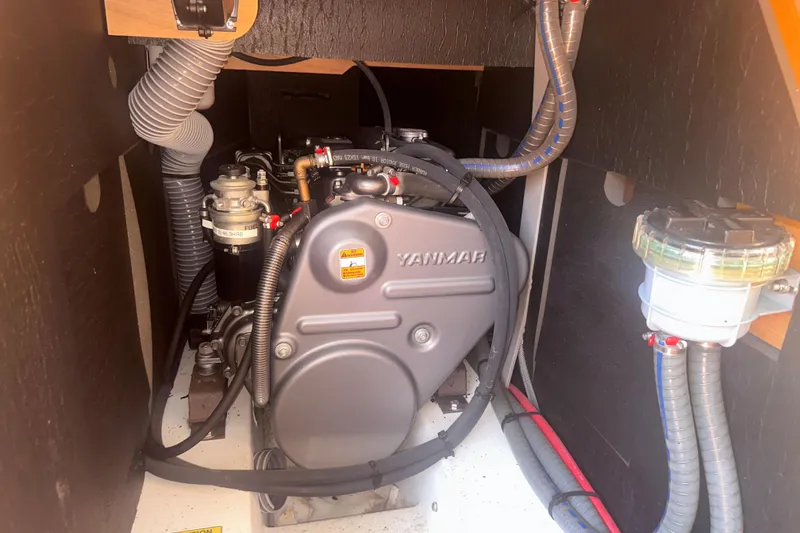 Slide: The Image of Engine compartment of a 2014 Jeanneau Sun Odyssey 509 sailboat, featuring a Yanmar engine. - 36