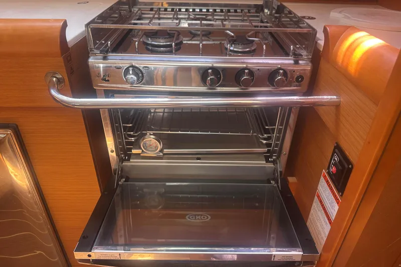 Slide: The Image of Stainless steel stove and oven in 2014 Jeanneau Sun Odyssey 509 yacht kitchen. - 27
