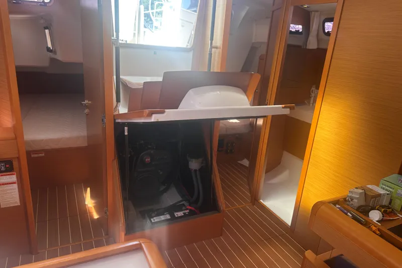 Slide: The Image of Interior of 2014 Jeanneau Sun Odyssey 509 sailboat, showcasing engine compartment and cabin layout. - 35