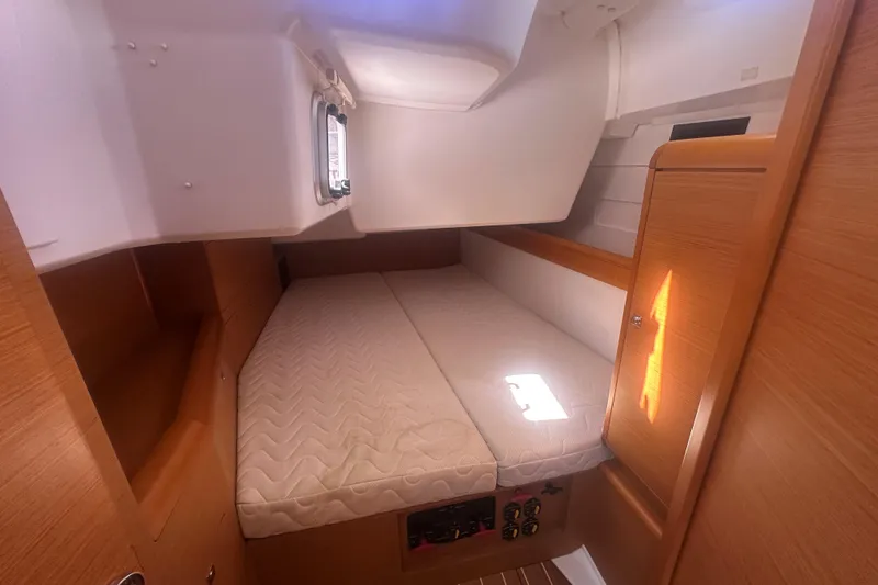 Slide: The Image of Cozy cabin interior of 2014 Jeanneau Sun Odyssey 509 sailboat with wooden finishes. - 19