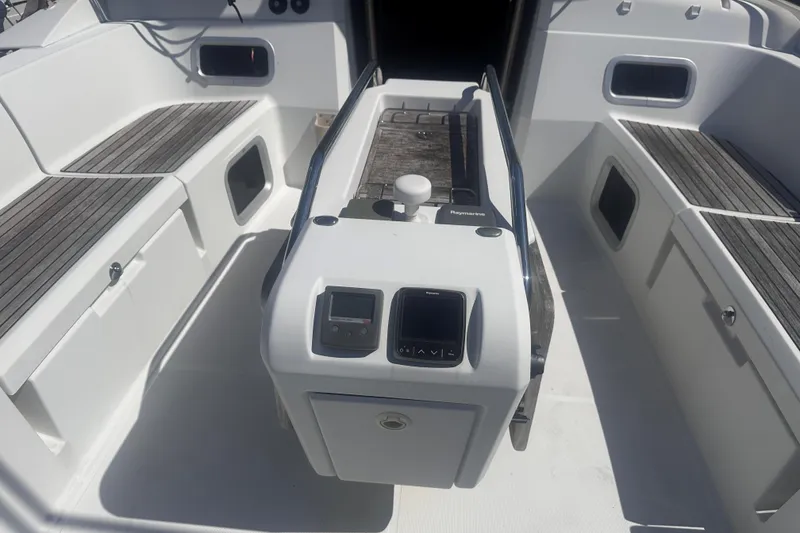 Slide: The Image of Cockpit of 2014 Jeanneau Sun Odyssey 509 sailboat with seating and navigation controls. - 4