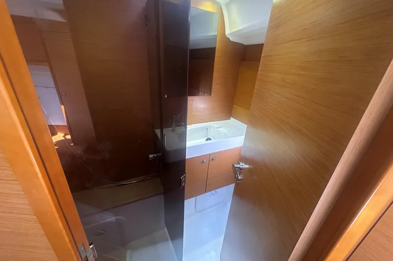 Slide: The Image of Bathroom interior of 2014 Jeanneau Sun Odyssey 509 yacht with wooden finish. - 34