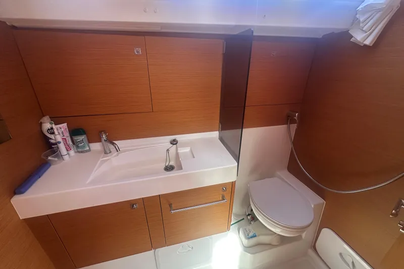 Slide: The Image of Bathroom interior of 2014 Jeanneau Sun Odyssey 509 yacht with sink and toilet. - 18