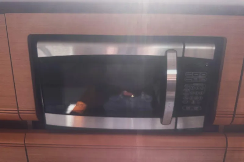 Slide: The Image of Built-in microwave in 2014 Jeanneau Sun Odyssey 509 yacht kitchen. - 29