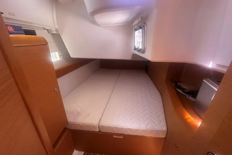 Slide: The Image of Interior cabin of 2014 Jeanneau Sun Odyssey 509 yacht with cozy bed and wooden finish. - 20