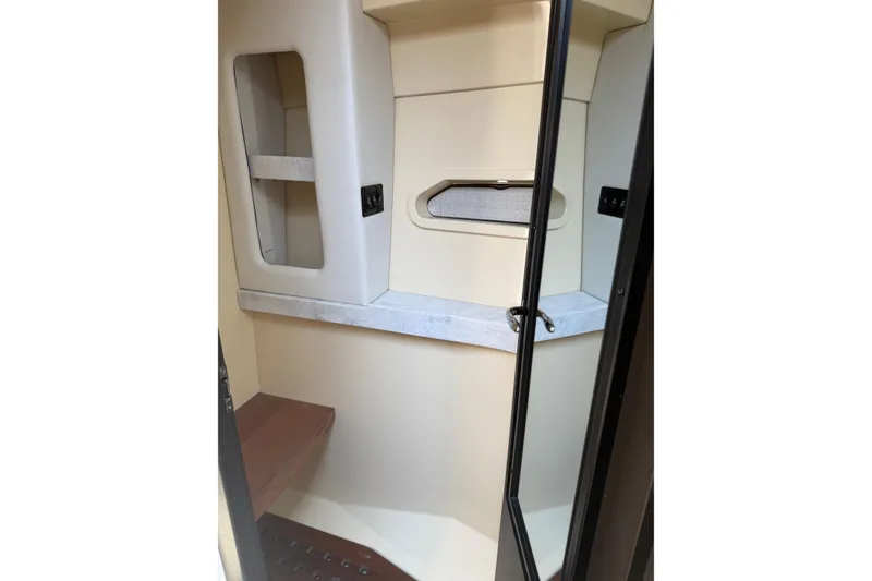 Slide: The Image of Interior cabin of 2020 Regal 38 Grande Coupe, featuring modern design and storage space. - 35