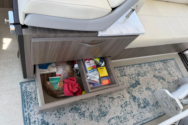 Slide: The Image of Open drawer in 2020 Regal 38 Grande Coupe, containing various items on a patterned rug. - 24