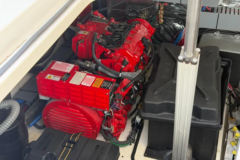 Slide: The Image of Engine compartment of a 2020 Regal 38 Grande Coupe with red machinery and wiring. - 41