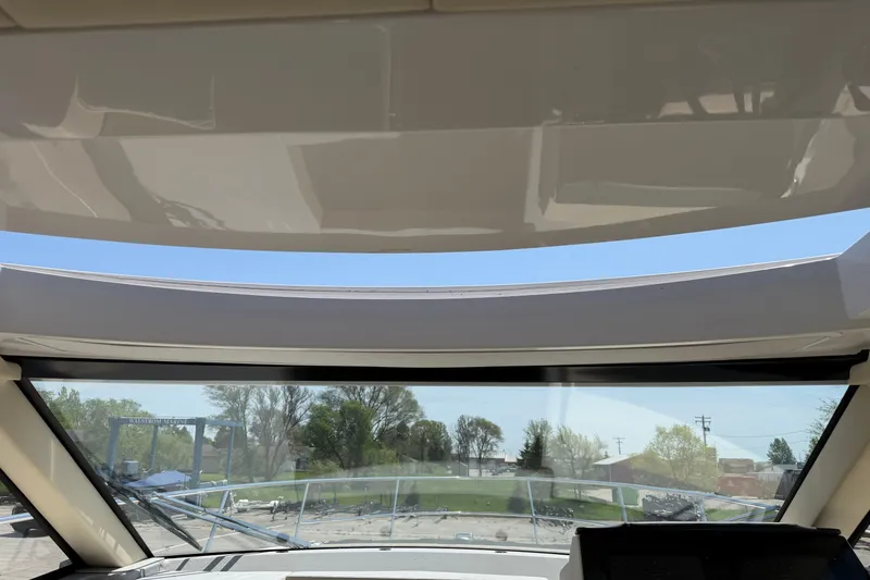 Slide: The Image of Interior view from the helm of a 2020 Regal 38 Grande Coupe yacht. - 17