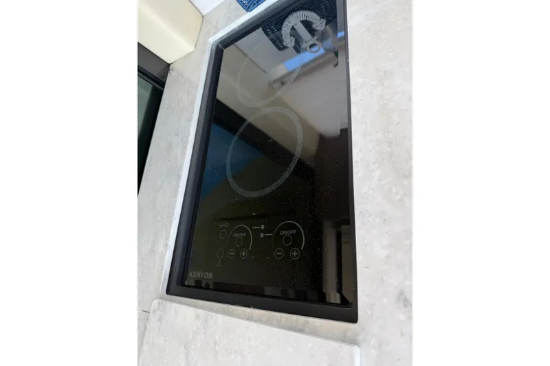 Slide: The Image of Kenyon cooktop on 2020 Regal 38 Grande Coupe yacht kitchen counter. - 15
