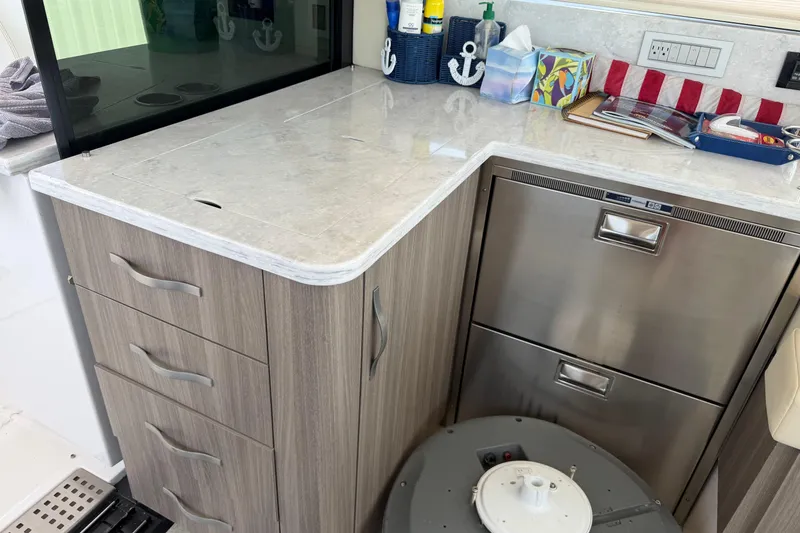 Slide: The Image of Modern kitchen area in a 2020 Regal 38 Grande Coupe yacht. - 22