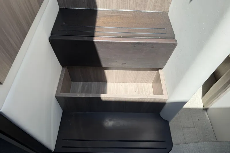 Slide: The Image of 2020 Regal 38 Grande Coupe interior stairs with storage compartment. - 27