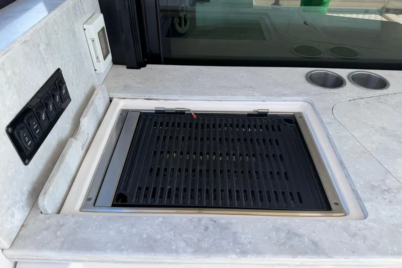 Slide: The Image of Built-in grill on 2020 Regal 38 Grande Coupe yacht's sleek countertop. - 13