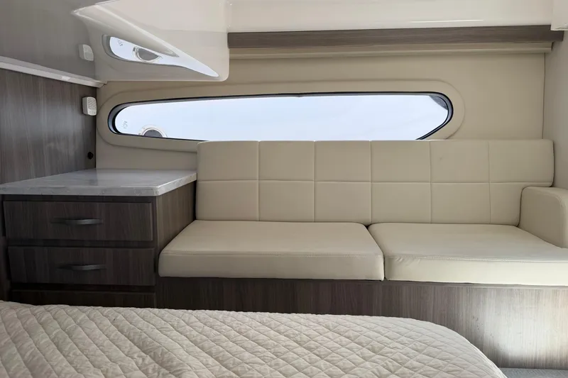 Slide: The Image of Interior of 2020 Regal 38 Grande Coupe with beige seating and wooden cabinetry. - 37