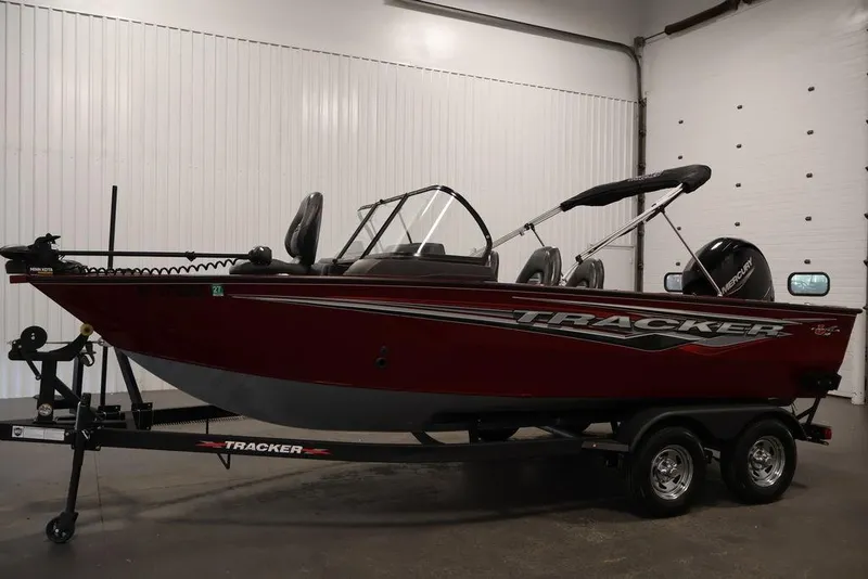 Slide: The Image of 2024 Tracker Targa V-18 Combo boat on trailer in indoor setting. - 22