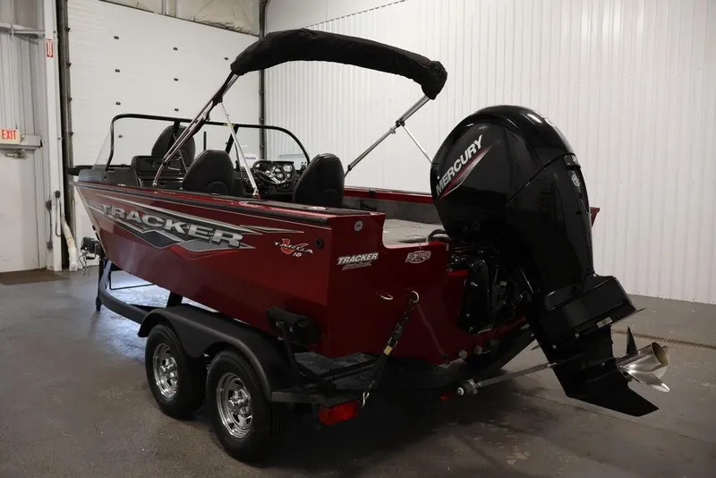 Slide: The Image of 2024 Tracker Targa V-18 Combo boat with Mercury engine in a showroom. - 42