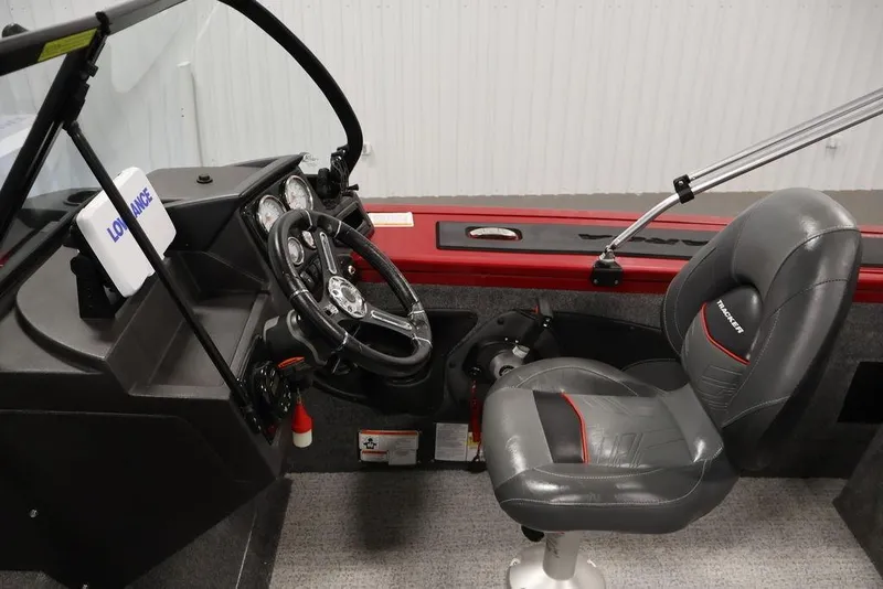 Slide: The Image of 2024 Tracker Targa V-18 Combo boat interior with steering wheel and seat. - 41