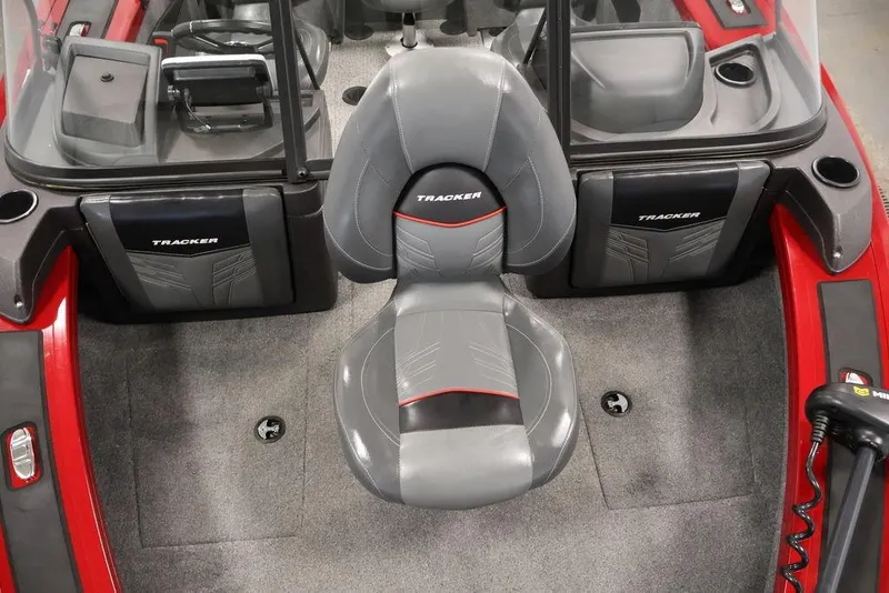 Slide: The Image of 2024 Tracker Targa V-18 Combo boat interior with gray seating and red accents. - 40
