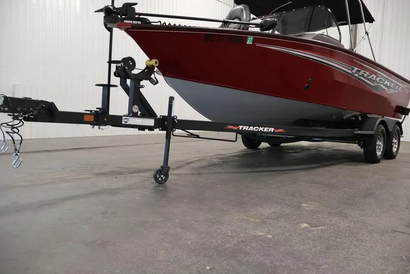 Slide: The Image of 2024 Tracker Targa V-18 Combo boat on trailer in indoor setting. - 53