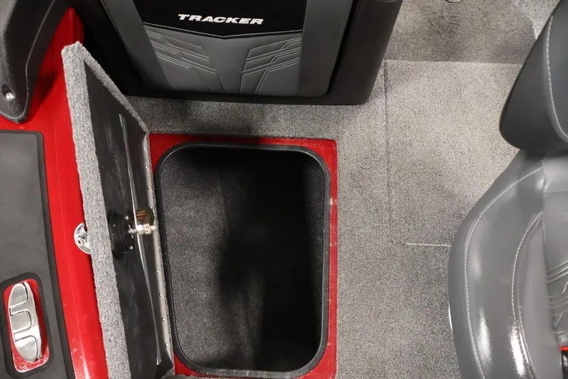 Slide: The Image of 2024 Tracker Targa V-18 Combo boat interior storage compartment with open lid. - 35