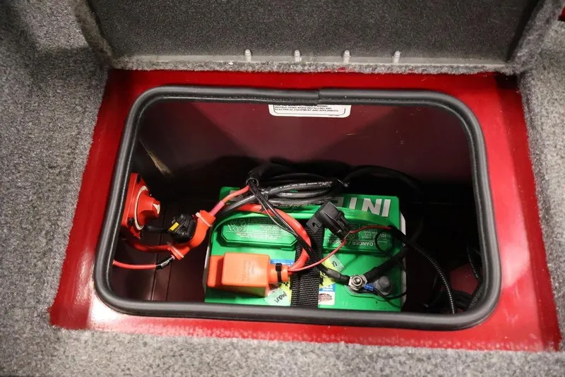 Slide: The Image of Battery compartment of 2024 Tracker Targa V-18 Combo boat, featuring wiring and connections. - 51