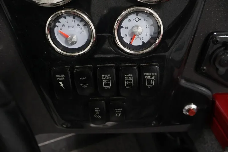 Slide: The Image of Control panel of 2024 Tracker Targa V-18 Combo with gauges and switches. - 56