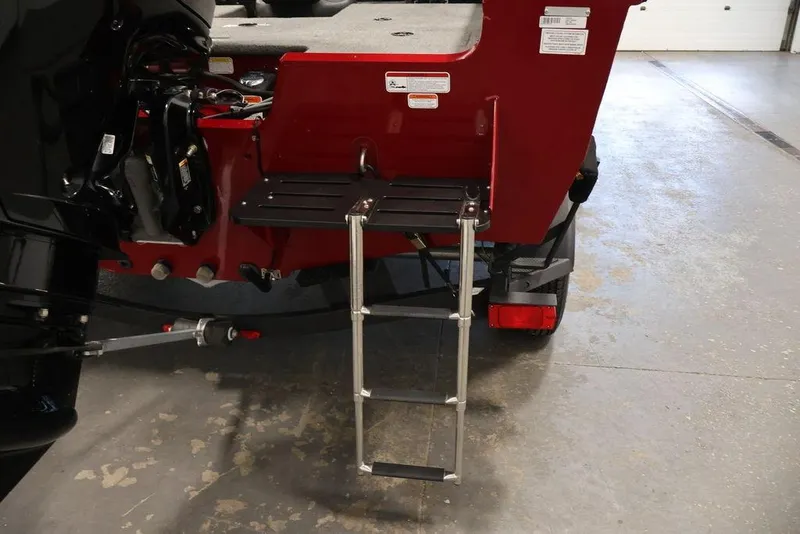Slide: The Image of 2024 Tracker Targa V-18 Combo boat with rear ladder and motor detail. - 57