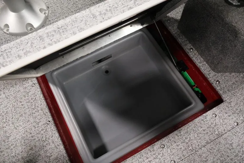 Slide: The Image of 2024 Tracker Targa V-18 Combo boat storage compartment with open lid. - 17