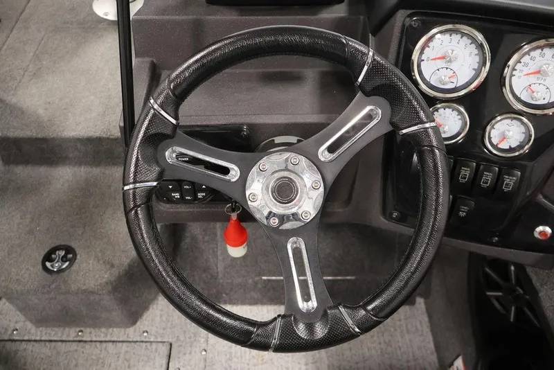 Slide: The Image of Steering wheel and dashboard of 2024 Tracker Targa V-18 Combo boat. - 29