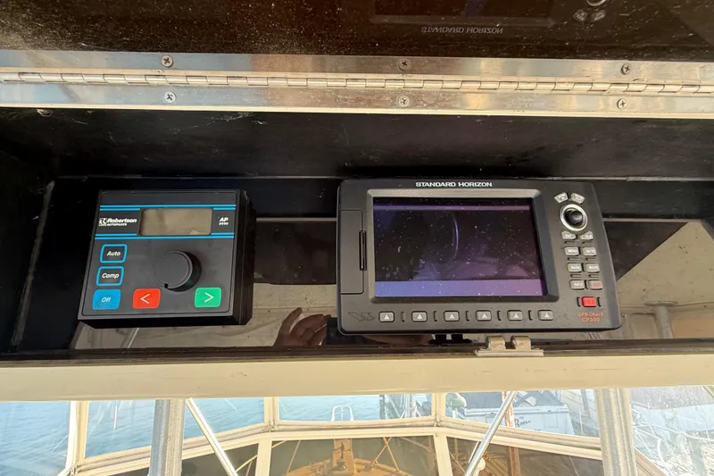 Slide: The Image of Control panel of a 1989 Viking 35 Convertible boat with navigation equipment. - 20