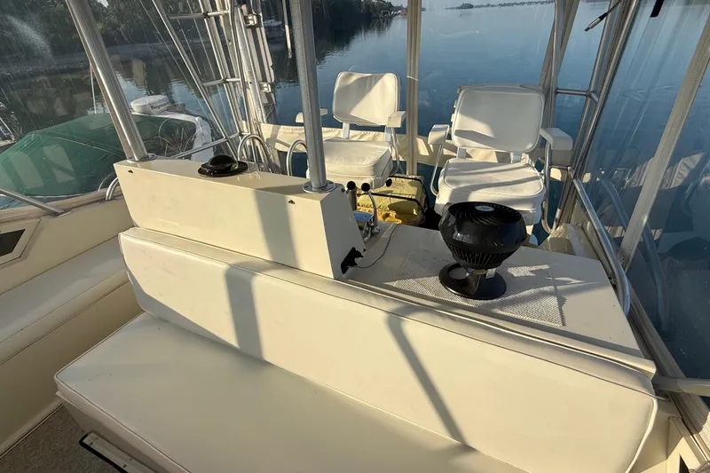 Slide: The Image of 1989 Viking 35 Convertible boat interior with seating and controls. - 15