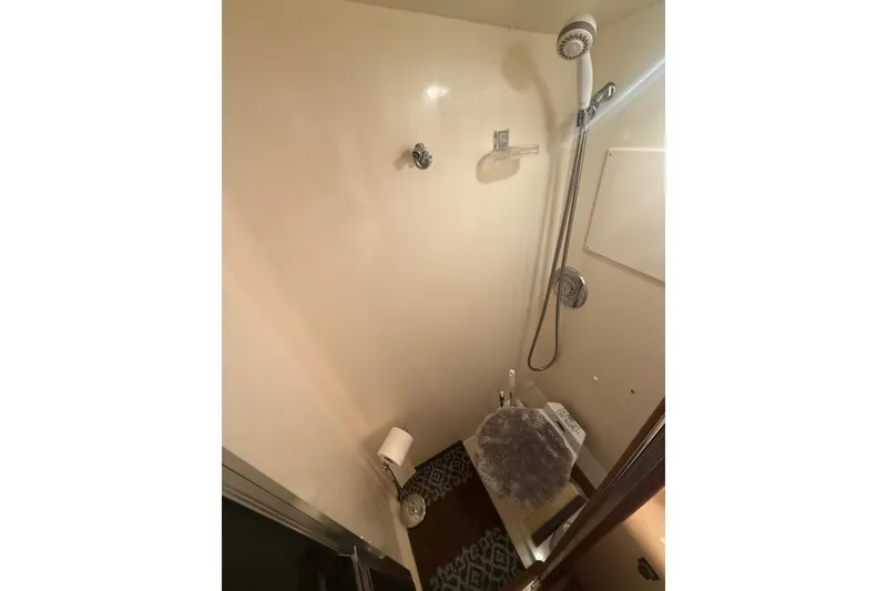 Slide: The Image of Shower area in 1989 Viking 35 Convertible boat bathroom. - 34