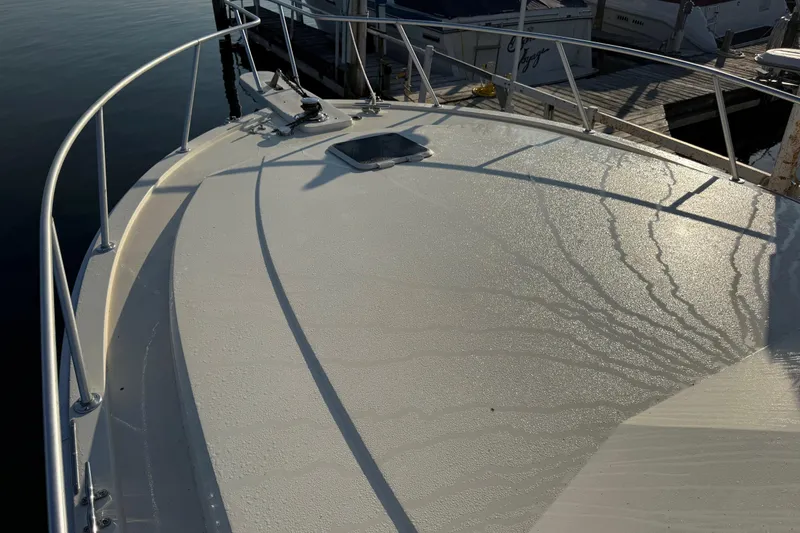 Slide: The Image of Bow of a 1989 Viking 35 Convertible boat with morning dew. - 10