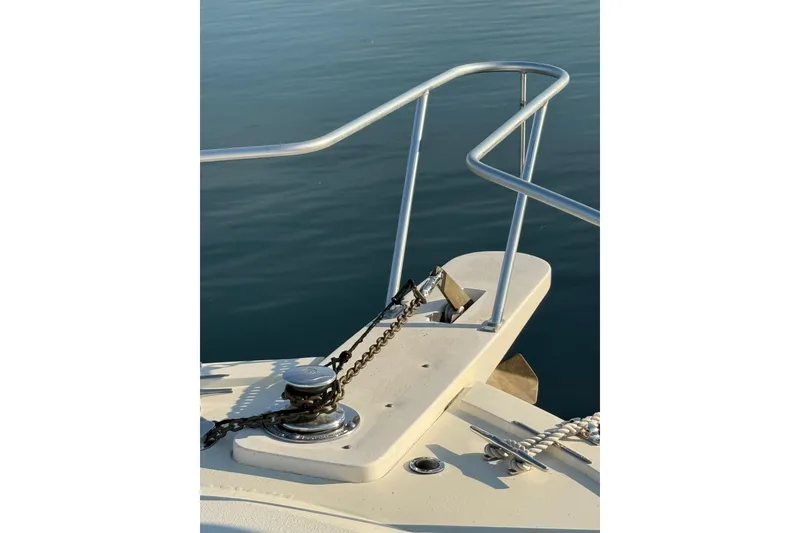 Slide: The Image of Bow of 1989 Viking 35 Convertible boat with anchor and railing. - 7