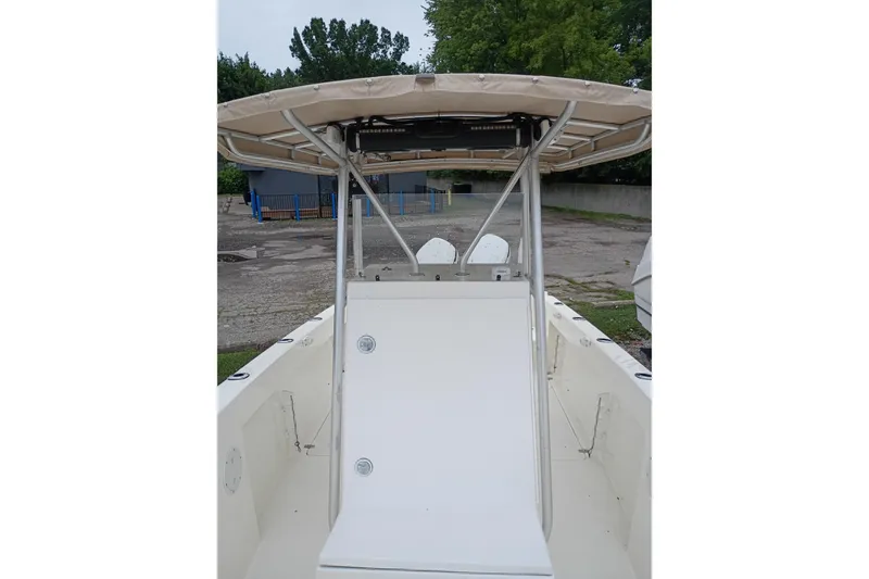 Slide: The Image of 2002 Paramount Supper Fish boat with canopy, viewed from the deck, parked outdoors. - 7