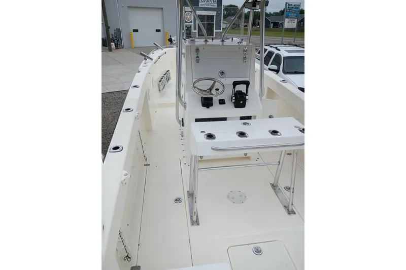 Slide: The Image of 2002 Paramount Supper Fish boat interior with steering console and rod holders. - 4