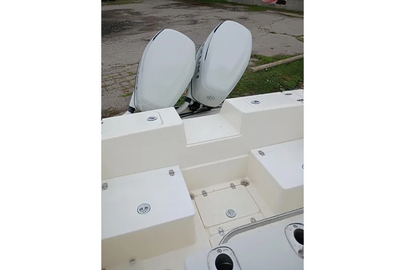 Slide: The Image of 2002 Paramount Supper Fish boat with dual outboard motors, viewed from the deck. - 2